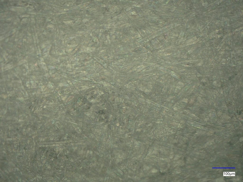 Keyence 300X microscopic image of coated white paper used in packaging. The sample was also tested with FTIR and XPS. 