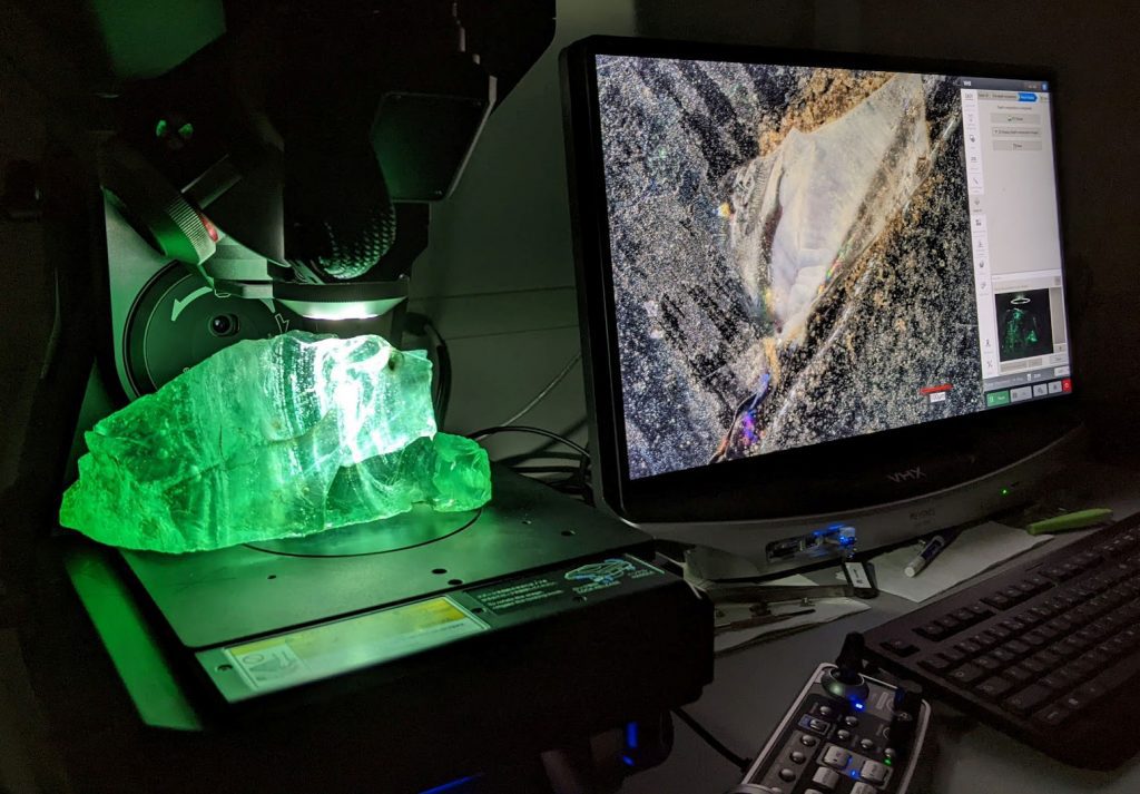 Large green glass rock examined by Keyence 7000N digital optical microscope at AME.