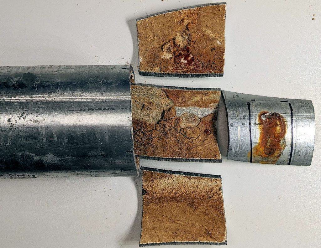 Interior corrosion of galvanized steel pipe of indoor sprinkler system.